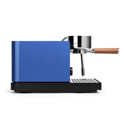 Marine Blue Fellow Espresso Series 1 Espresso Machine side view with portafilter attached, showcasing sleek design and precision.